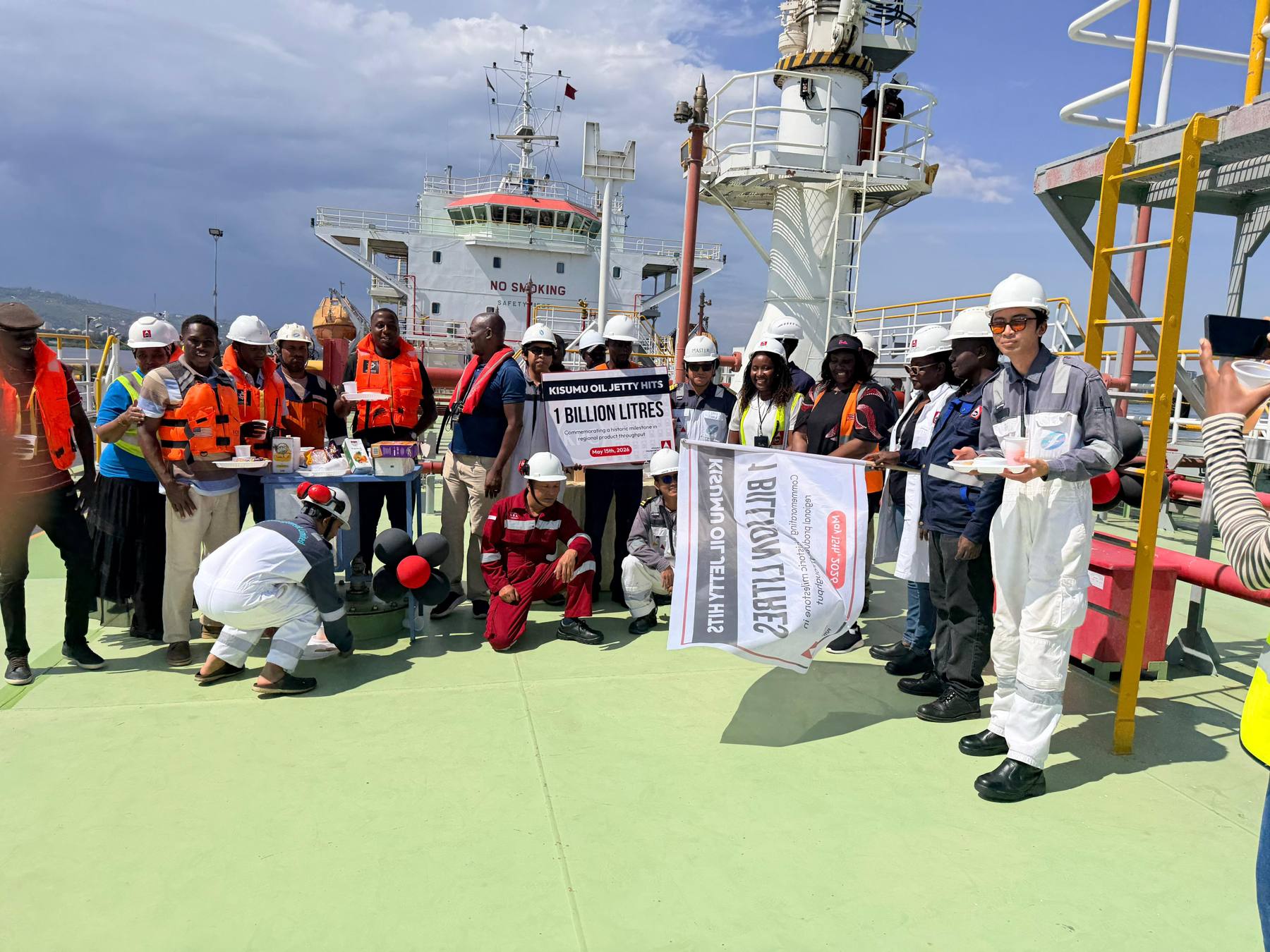 Crew and partners lined up on deck